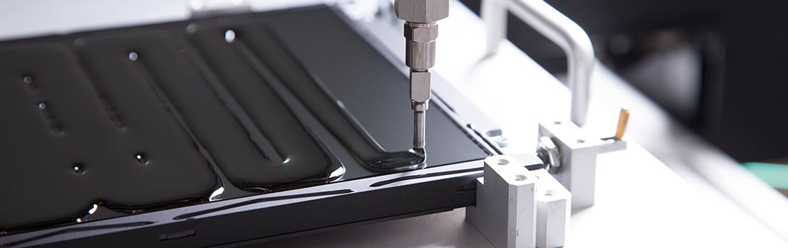 Liquid optically clear adhesive dispensing onto layers of a display The-Rail-Industry-and-Boyd-Solutions