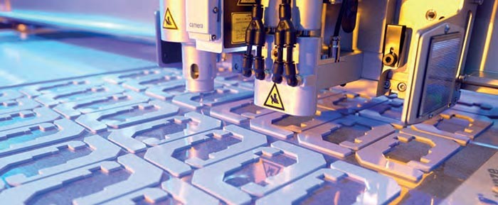machine cutting thermal interface material into different shapes