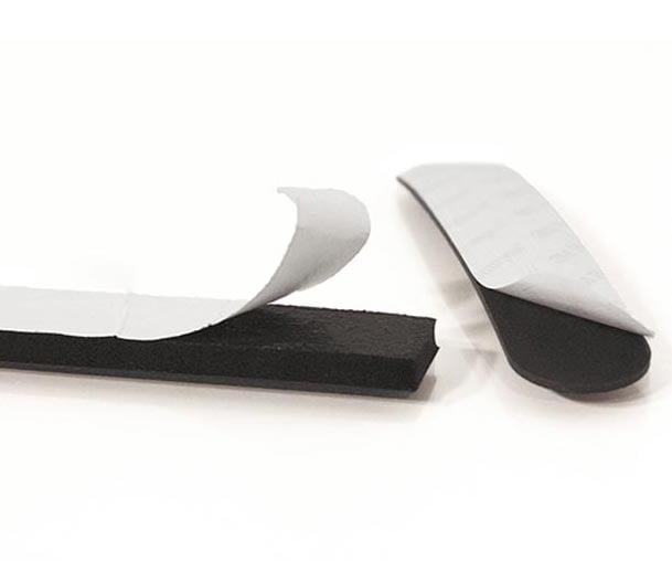 extruded foam seals with adhesive liners being removed