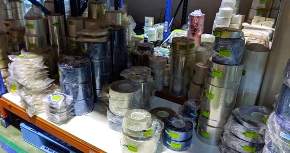 sealed rolls of tape sitting in inventory shelves