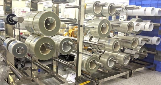 Tapes-566x300-1 rack with rolls of optically clear adhesives and materials housed in a clean room environment
